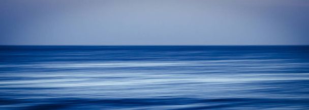 stretched ocean blue water in long exposure with movement  - Photo, Image