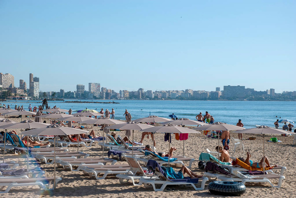 Crowded beach of Alicante at Costa Blanca - Spain, with sun shades and sun beds - Photo, Image