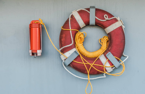 Lifebuoy with light and smoke on the wall of the ship for use in case of emergency - Photo, Image