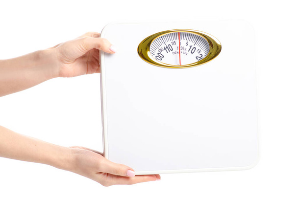 weighing scale in hand on a white background isolation - Photo, Image