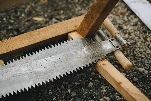two-handed saw with wooden handles close-up. - Foto, Imagem