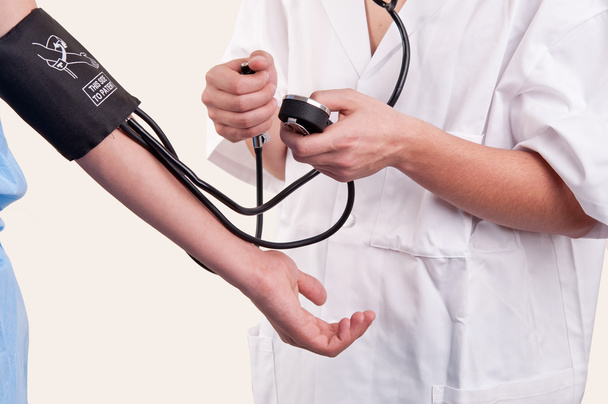 Doctor measuring blood pressure - Foto, Imagem