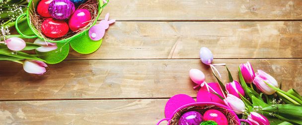  Easter eggs and tulips on wooden planks with German text Happy Easter - Fotoğraf, Görsel