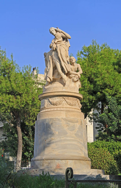 Public XIX century sculpture of the famous British poet Lord Byron crowned by personification of Greece in the National Garden in Athens, Greece with blue sky copy space. - Photo, Image