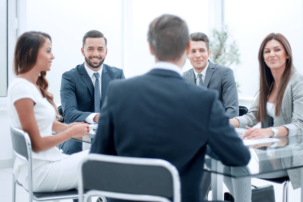 group of business people sitting at a table at an office working meeting - Fotoğraf, Görsel