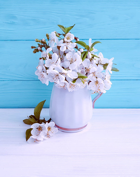 blooming cherry vase on a wooden background, spring - Фото, зображення