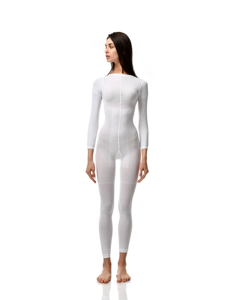 Full body brunette woman in white single use suit cloth ready for medical science research experiment full length  - Fotografie, Obrázek