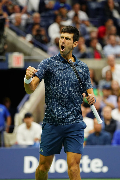 NEW YORK - SEPTEMBER 9, 2018: 2018 US Open Champion Novak Djokovic of Serbia in action during his final match against Juan Martin del Potro at USTA National Tennis Center - Фото, изображение