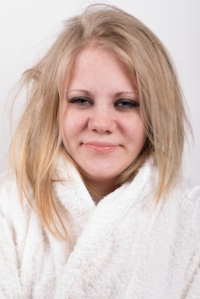 tired young cute woman in bathrobe - Zdjęcie, obraz