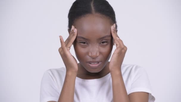 Young stressed African woman having headache - Video, Çekim