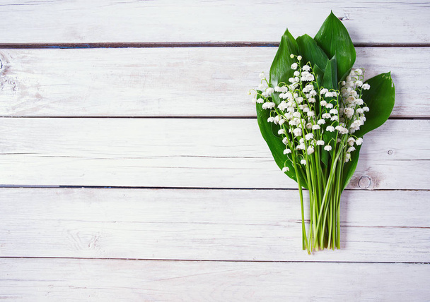 beautiful lily of the valley flowers on wooden surface - Fotografie, Obrázek