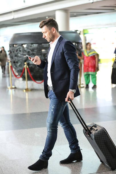 Retired Bosnian-born Croatian football star Darko Matic is pictured after arriving at the Beijing Capital International Airport in Beijing, China, 2 April 2017. - Фото, изображение