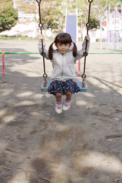 Japanese girl on the swing (4 years old) - Photo, Image