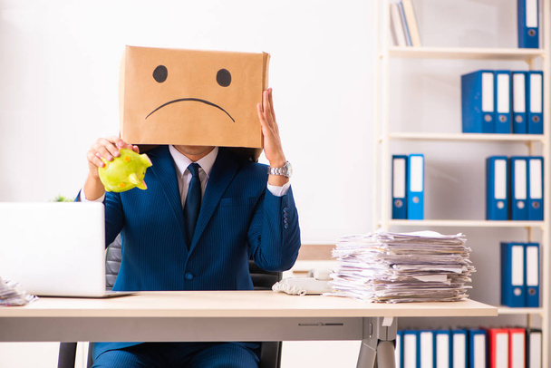 Unhappy man employee with box instead of his head  - Photo, Image