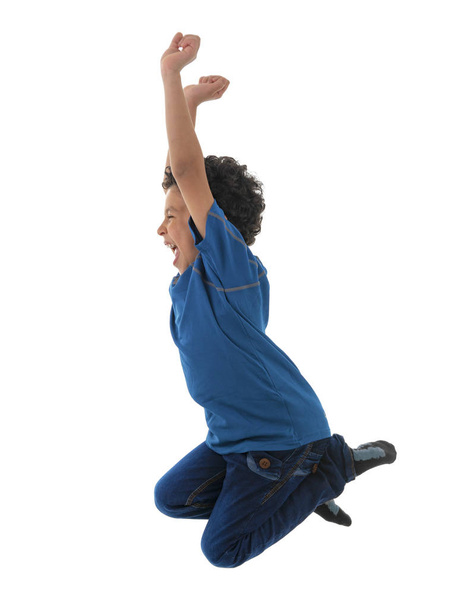 Young Active Happy Boy Jumping in The Air Isolated on White Background - Photo, Image