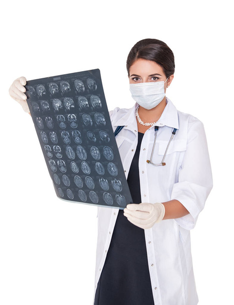Woman doctor checking x-ray film of head isolated on white background - Foto, afbeelding