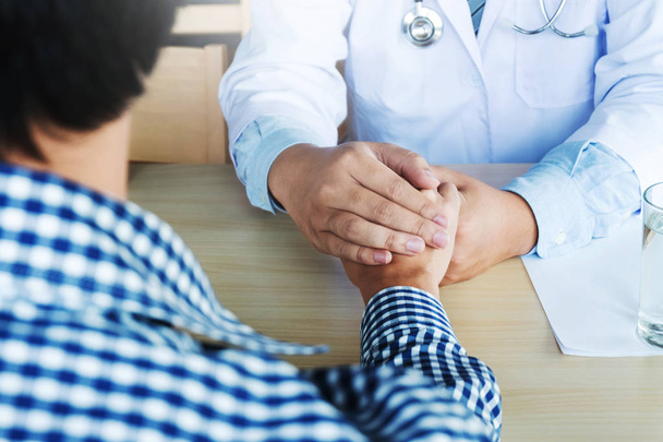 Hand of doctor reassuring his patient - Photo, Image