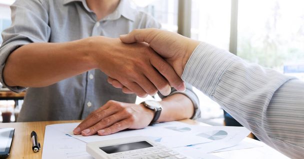 business shaking hands in a modern office - Photo, Image