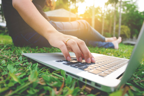 young asian woman using laptop at a outdoors - Foto, Imagen