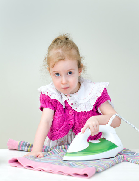 Cute little girl ironing clothes - Fotoğraf, Görsel
