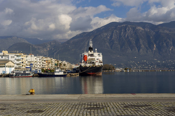 Seascape. The embankment of the city of Kalamata with moored big, cargo vessel(Greece, Prefecture of Messinia, Peloponnese) - Photo, Image