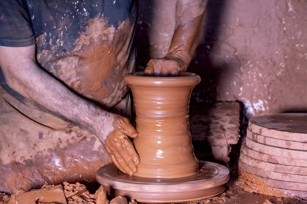 Professional potter making bowl in pottery workshop, studio.  - Photo, Image
