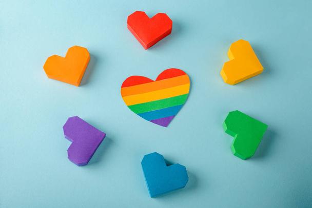 Multicolor paper hearts on blue - Fotografie, Obrázek