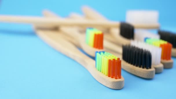 Set of toothbrushes on blue background - Footage, Video