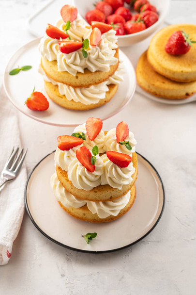 Strawberry cake with vanilla cream on white background. Copy space. - Foto, Imagen