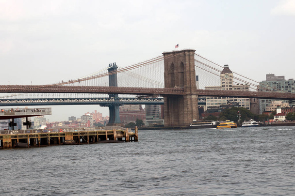 Brooklyn Bridge in New York City. Famous landmark in USA at morning light - Photo, image