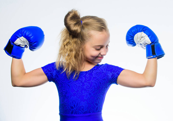 Strong child boxing. Sport and health concept. Boxing sport for female. Be strong. Girl child with blue gloves posing on white background. Sport upbringing. Upbringing for leadership and winner - Foto, immagini