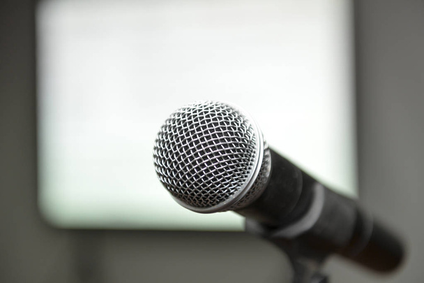 microphone with a blurred background audience - Photo, Image