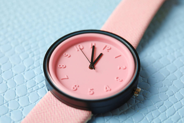 Stylish wrist watch on color background, closeup. Fashion accessory - Foto, Imagem