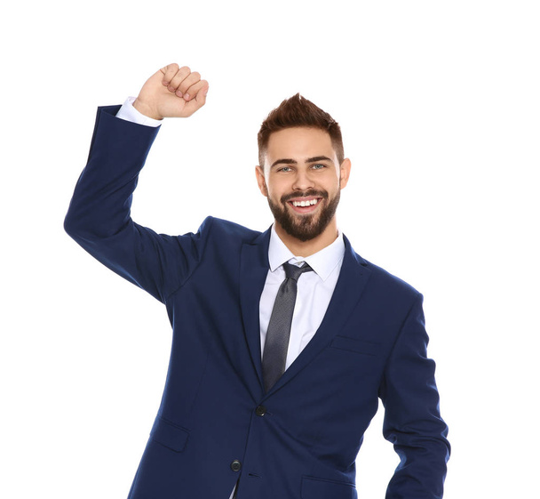 Happy young man celebrating victory on color background - Foto, Imagen