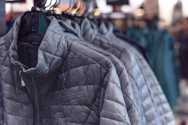 Row of women down jackets at American outdoor clothing store - Photo, Image