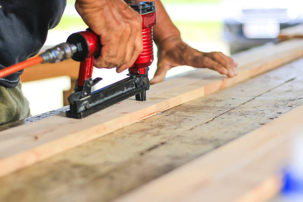 Carpenters are using tools with wood working furniture. - Photo, Image