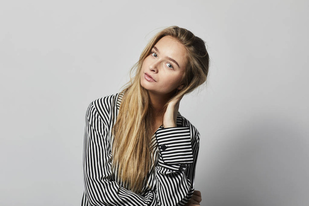 Beautiful woman in stripes in studio - Fotoğraf, Görsel