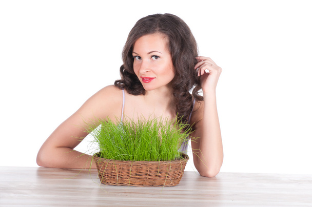 beautiful woman with easter basket with green grass - Photo, image