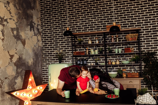 Happy mother father and cute son on kitchen  - Valokuva, kuva