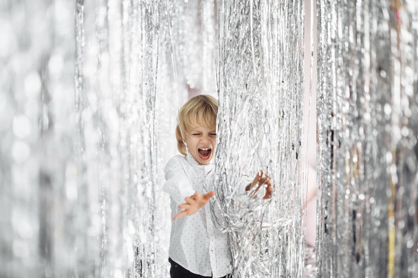 Happy cute boy  having fun in studio with holiday decoration  - Photo, Image