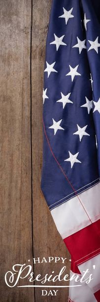 Happy presidents day against american flag on a wooden table - Фото, изображение