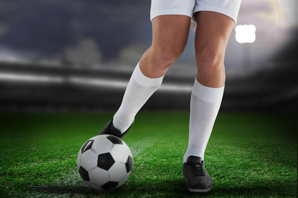 Football player against close-up of soccer field - Photo, Image