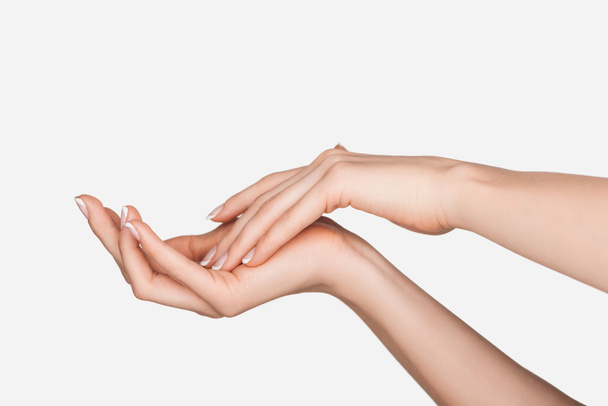 vue partielle des mains féminines isolées sur blanc
 - Photo, image