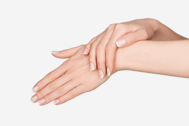 vista recortada de las manos femeninas aisladas en blanco - Foto, imagen