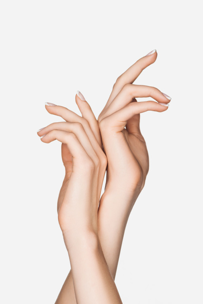 visión parcial del gesto de la mujer con las manos aisladas en blanco
 - Foto, imagen