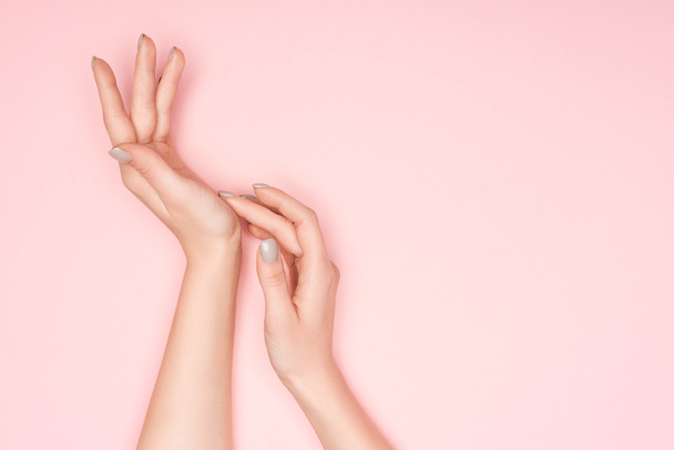cropped view of female hands isolated on pink with copy space - Photo, Image