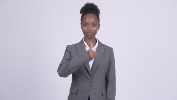 Young beautiful African businesswoman giving thumbs up - Felvétel, videó