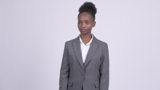 Young beautiful African businesswoman giving thumbs up - Filmagem, Vídeo