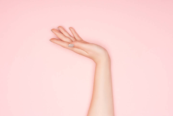 cropped view of female hand with copy space isolated on pink - Photo, Image
