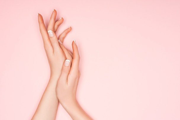 cropped view of female hands isolated on pink - Fotó, kép